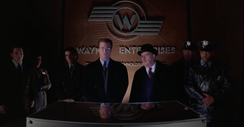 A wide shot from "Batman Forever" featuring Jon Favreau, Val Kilmer and Pat Hingle.