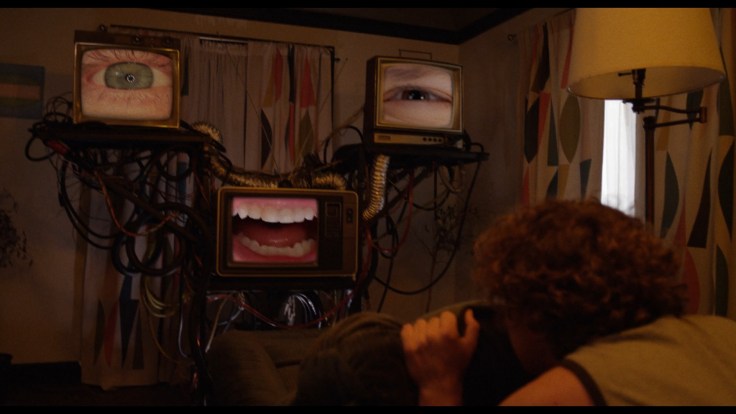 Jacob encountering a face made of TVs in W.M. Weikart's "Soul to Squeeze" (2025)