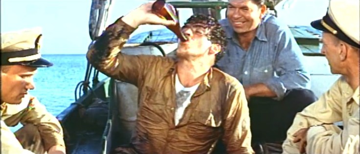 Victor Mature drinking a well-deserved beer in "The Sharkfighters" (1956)