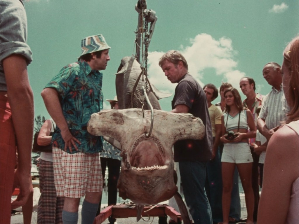 Richard Jaeckel harassing a bunch of tourists over a hammerhead carcass in "Mako: The Jaws of Death" (1976)