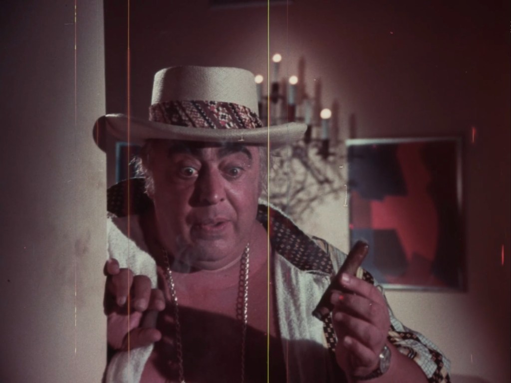 Buffy Dee looking surprised, but not shocked, at the revelation that his hired goons are a couple of creeps in "Mako: The Jaws of Death" (1976)