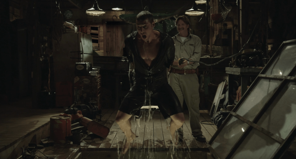 Dustin Milligan and Donal Logue in "Shark Night" (2011).